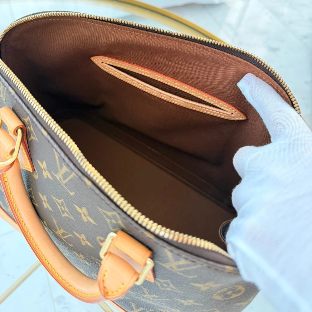 Louis Vuitton | Alma PM monogram handbag