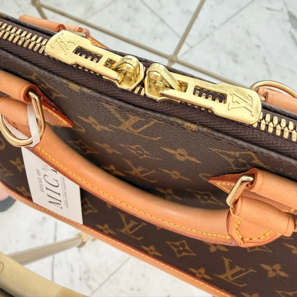 Louis Vuitton | Alma PM monogram handbag