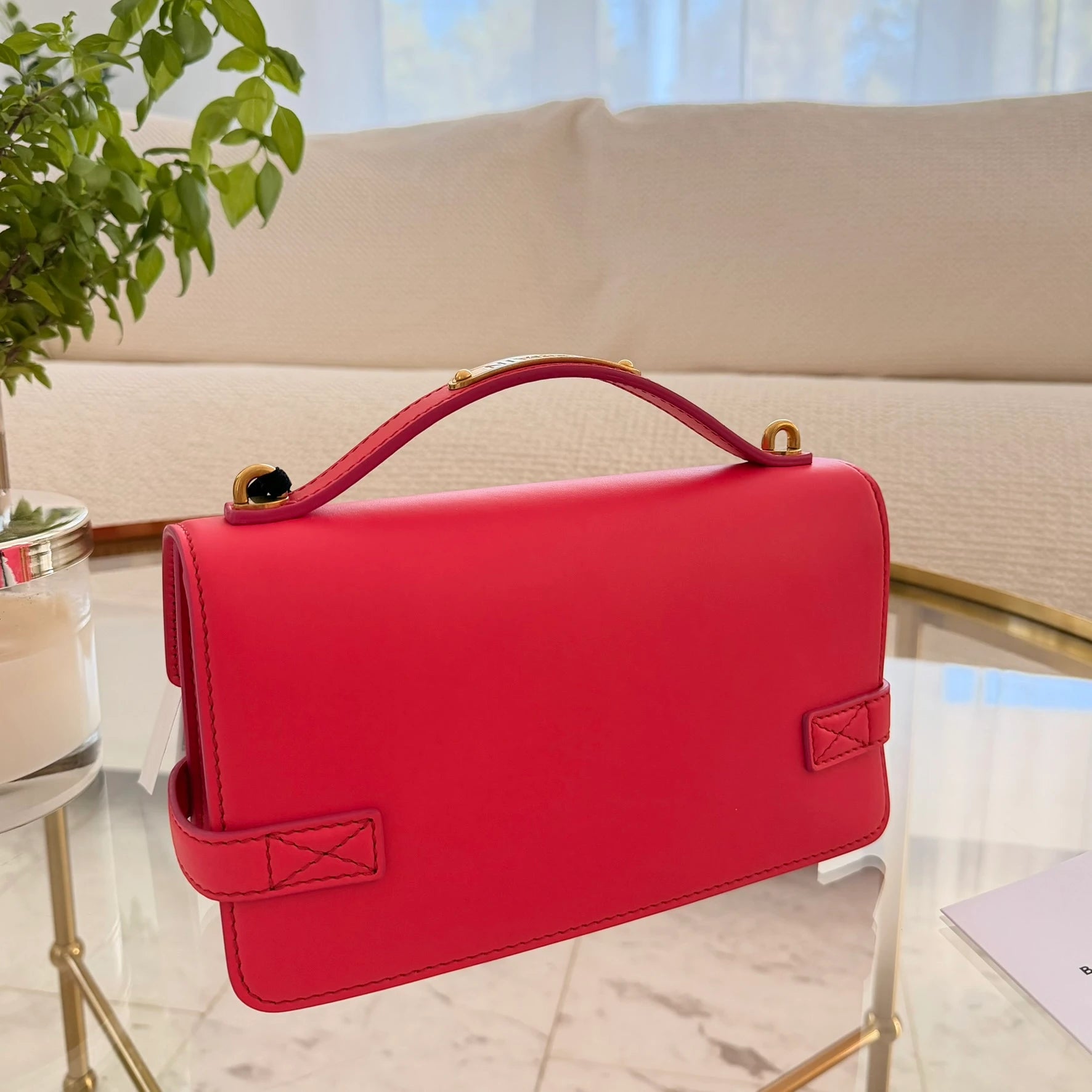 Balmain | 24 B-Buzz leather crossbody bag in Pink