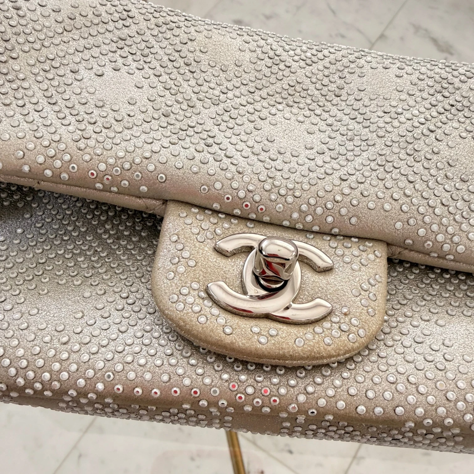 Close-up of a Chanel handbag with a textured surface and CC logo available in Cyprus at HOUSE of MICY