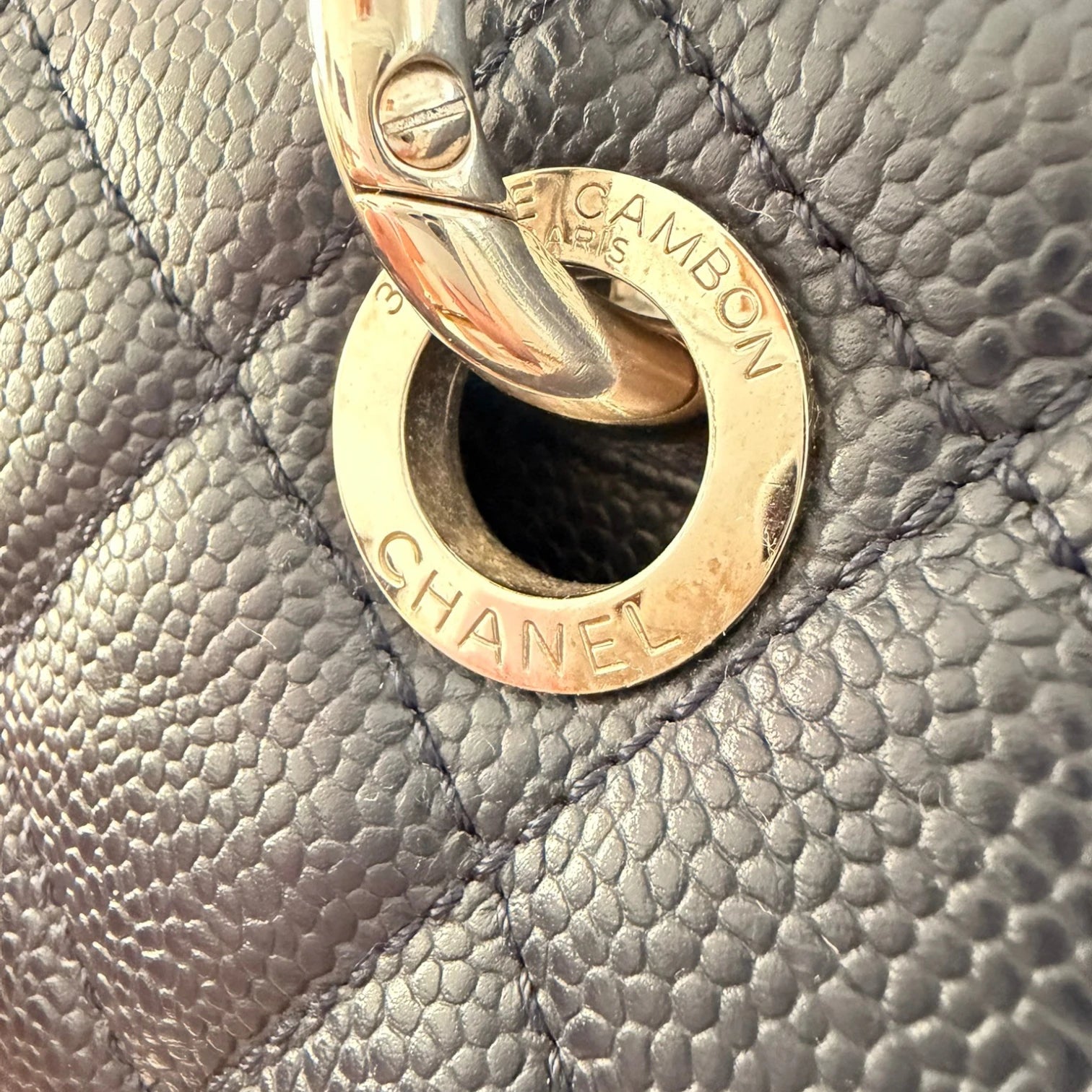 Close-up of a Chanel handbag with a silver chain available in Cyprus at HOUSE of MICY