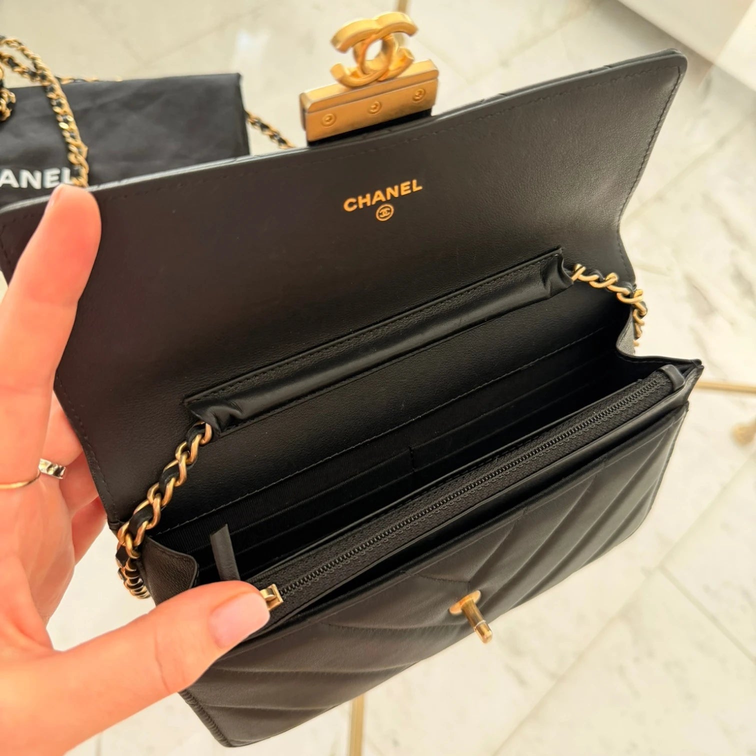 Chanel WOC interior card slots and zip pocket available in Cyprus