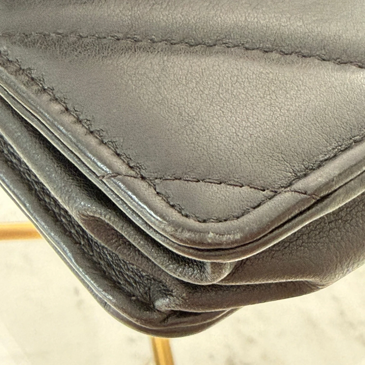 Wear of the corner of the Chanel CC  bag with turn-lock closure on quilted leather available in Cyprus