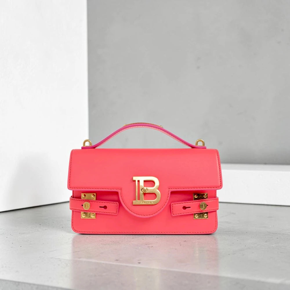 Balmain | 24 B-Buzz leather crossbody bag in Pink