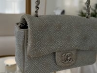 Chanel iridescent studded calfskin Mini Flap crossbody bag, with a chain strap and silver hardware available in Cyprus at HOUSE of MICY